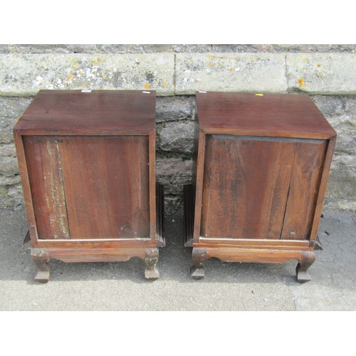 1167 - A pair of contemporary hardwood chests each enclosing four drawers, on shaped supports, 46cm wide x ... 