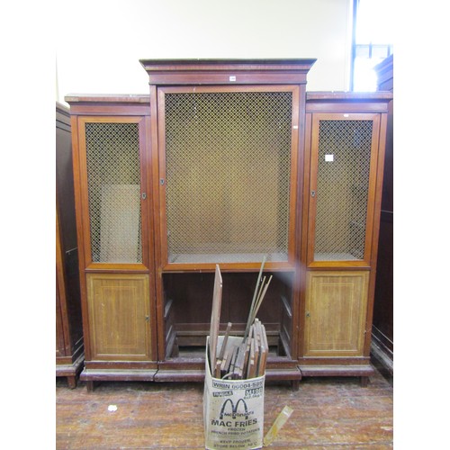 1369 - 19th century mahogany breakfront three sectional cupboard with geometric brass grilled doors, fitted... 