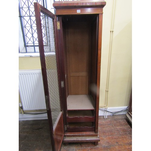 1370 - 19th century cupboard of square cut tapering form enclosed by a brass grilled door, 50cm wide