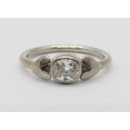 385 - Stylised white metal bezel set diamond solitaire ring, 0.20ct approx, size H/I, 2.3g