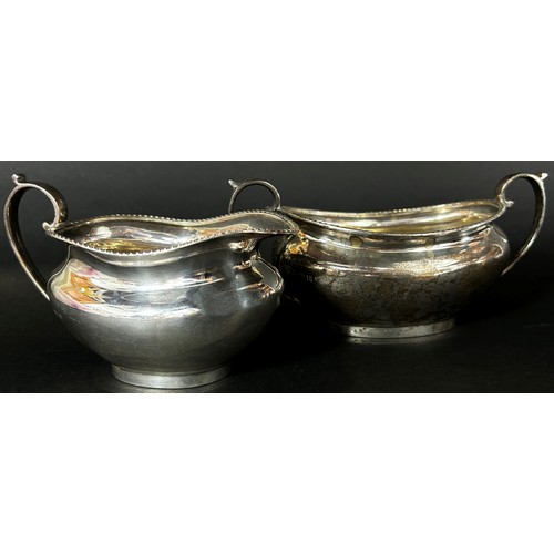 201 - A silver cream jug and sugar bowl matching, Birmingham 1930 & 1929 respectively, maker Barker Brothe... 