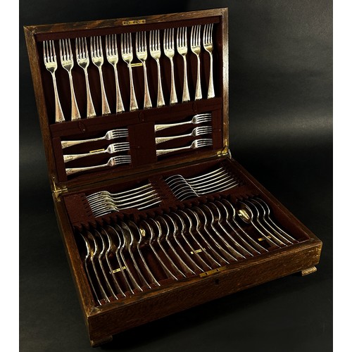 203 - An oak canteen of silver cutlery for twelve settings, dessert spoons, dessert forks, table forks, so... 