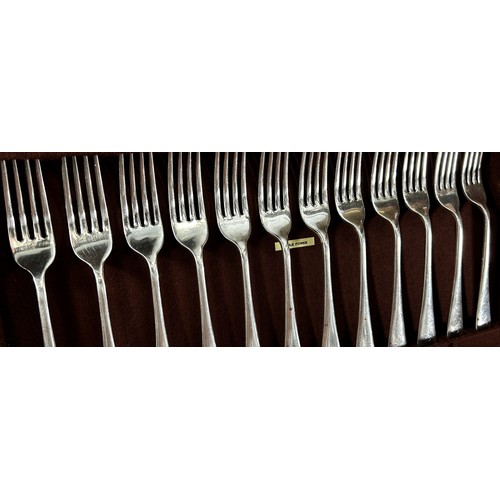 203 - An oak canteen of silver cutlery for twelve settings, dessert spoons, dessert forks, table forks, so... 