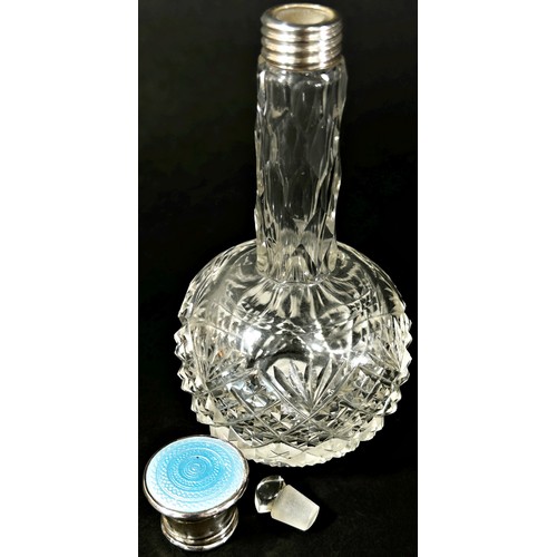 206 - A silver capped glass dressing table bottle London 1925 and a small glass perfume bottle with a silv... 