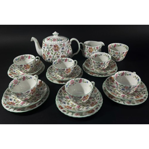 11 - A quantity of Minton's Haddon Hall pattern tea wares comprising teapot, milk jug, sugar basin, cake ... 