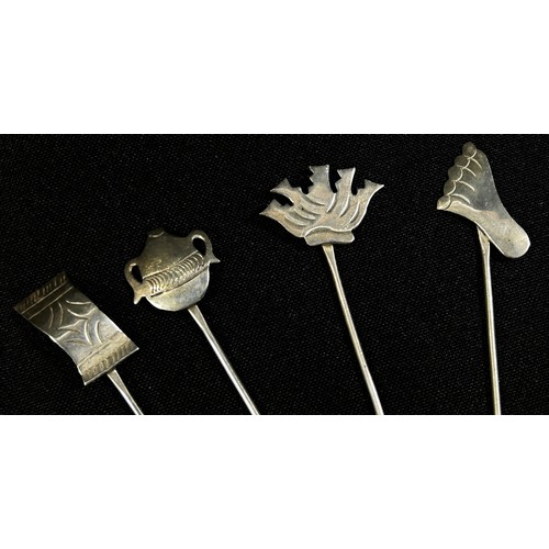 226 - Twelve Mexican silver cocktail sticks/forks stamped 925 decorated with cacti, sombrero, an earthenwa... 