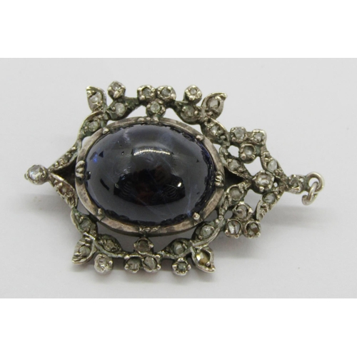 389 - 19th century silver brooch / pendant collet set with a large cabochon sapphire within rose-cut diamo... 