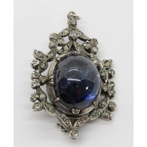 389 - 19th century silver brooch / pendant collet set with a large cabochon sapphire within rose-cut diamo... 