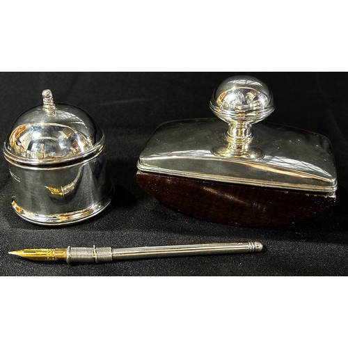 233 - A silver pen and inkstand with a silver inkwell and blotter and a small hinged space for a selection... 