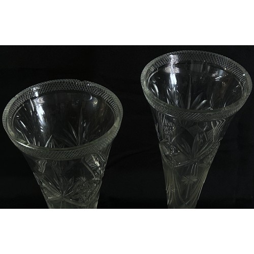 156 - A pair of tall trumpet shaped cut glass vases on a flared base, 33cm tall, (small chip to one on lip... 