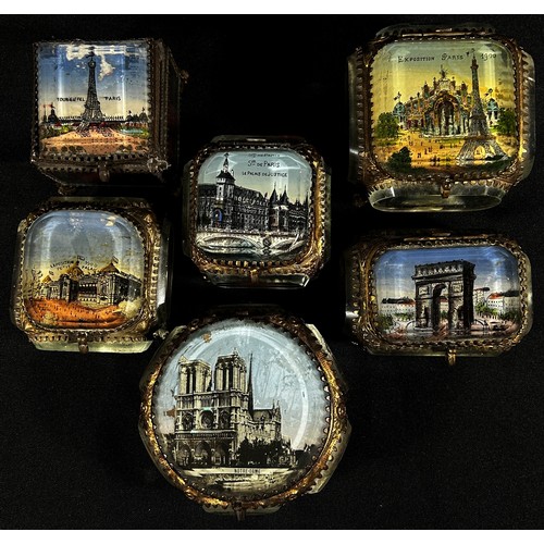 163 - Six late 19th century glass gilt metal mounted jewellery caskets, with Parisian landmarks to the lid... 