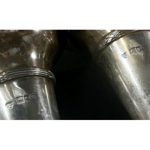 256 - A pair of early 20th century silver trumpet shaped posy vases, London 1907 maker Goldsmith & Silvers... 