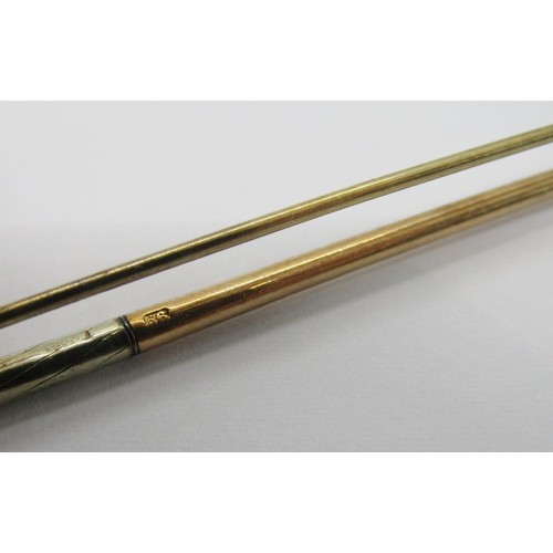 273 - 9ct bi-colour tie pin in the form of a golf club, 8.5cm L approx, 4.6g