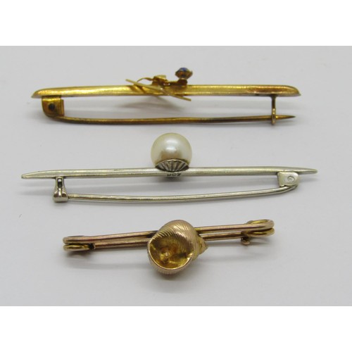 280 - Three antique 9ct brooches comprising a white gold example set with a pearl, a seashell design examp... 