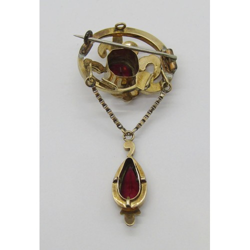 282 - 19th century yellow metal garnet drop brooch with scrolled detail, 6cm L approx, 7.4g