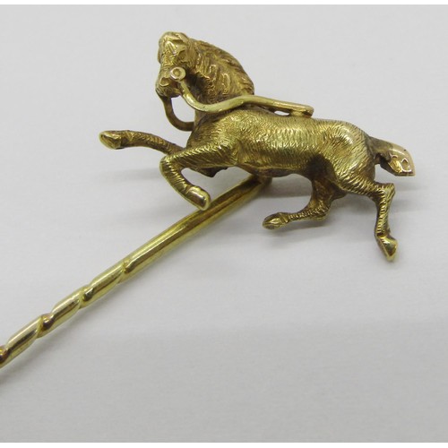 286 - 14ct figural stick pin modelled as a galloping horse, 1.8g