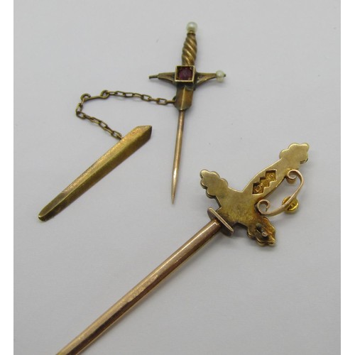 288 - Two sword design jabot pins; a 15ct example set with pearls (a few vacant) and a smaller yellow meta... 