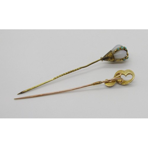 291 - Two 19th century yellow metal stick pins; a chalcedony and turquoise example (2 turquoise vacant) an... 