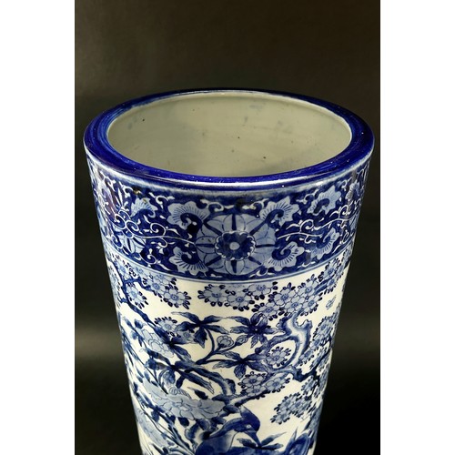 51 - A Chinese blue and white cylindrical stickstand decorated with pheasants, foliage and set within rep... 