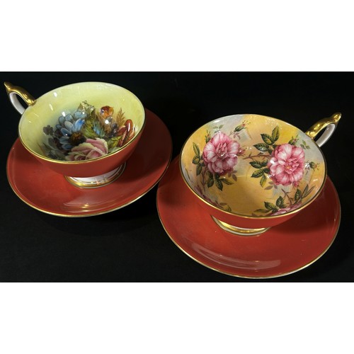 64 - A pair of Aynsley cabinet cup and saucers, the interiors with floral detail, one signed ‘Bailey’