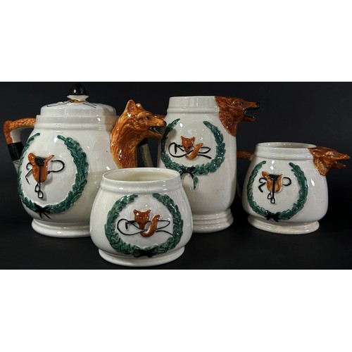 82 - A four piece 'Huntsman' ceramic tea set with fox mask spouts, riding crop handles, etc