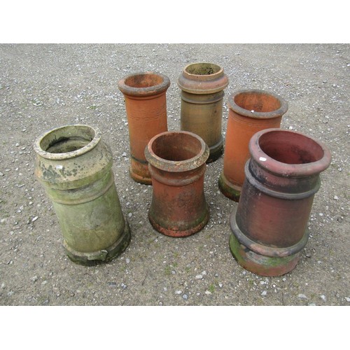 1018 - Six reclaimed weathered cylindrical chimney pots of varying size and design, the tallest example 62 ... 