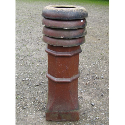 1021 - A Victorian salt glazed octagonal chimney pot with louvre vented and crown top, 104 cm high (af)