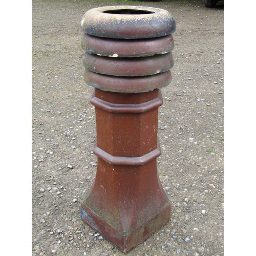 1021 - A Victorian salt glazed octagonal chimney pot with louvre vented and crown top, 104 cm high (af)