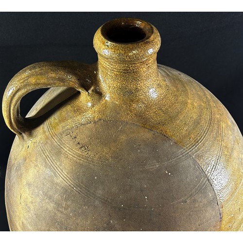 50 - A 19th century or earlier salt glazed ewer with loop handle