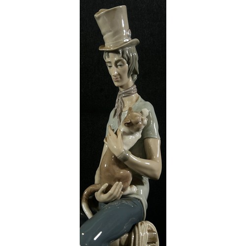 57 - A large Lladro figure of a chimney sweep seated upon a chimney stack holding a cat 'Sad Chimney Swee... 