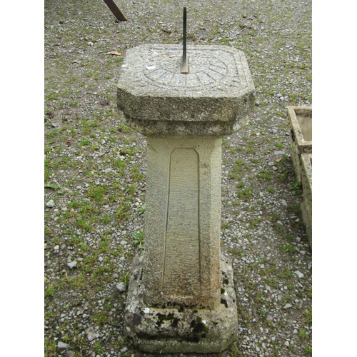 1041 - A weathered two sectional composition stone sun dial of square cut canted and stepped form with fixe... 