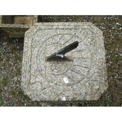 1041 - A weathered two sectional composition stone sun dial of square cut canted and stepped form with fixe... 