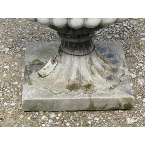 1044 - A Sandford cast composition stone garden urn, the squat circular lobed bowl with flared egg and dart... 