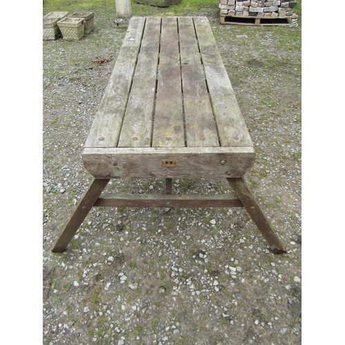 1046 - A weathered Hattersley Keighley teak garden table, the rectangular slatted top raised on splayed 'A'... 