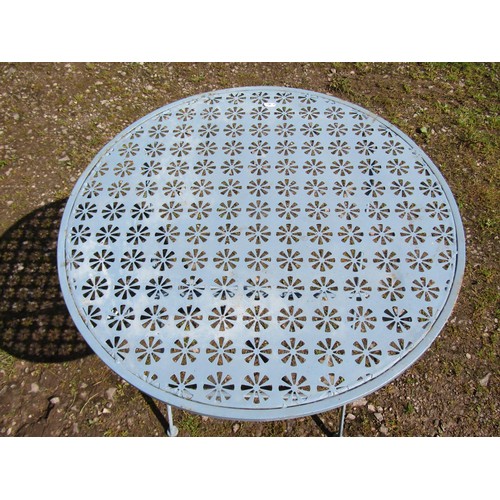 1048 - A weathered light blue painted steel three piece folding garden terrace/bistro set with decorative p... 