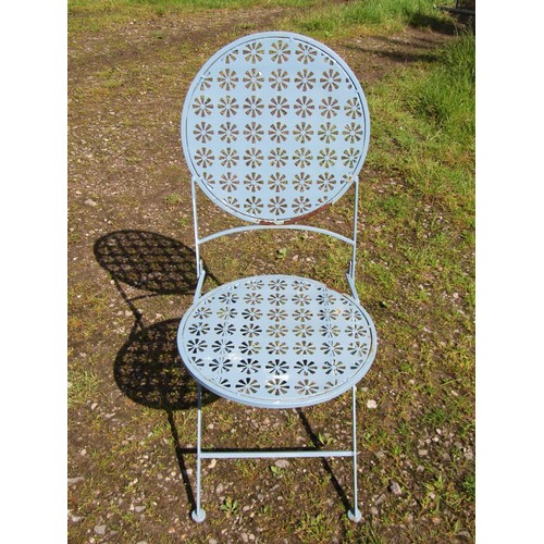 1048 - A weathered light blue painted steel three piece folding garden terrace/bistro set with decorative p... 