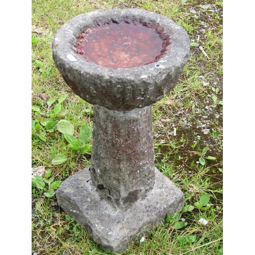 1055 - A small weathered three sectional carved stone bird bath with circular top 55 cm high x 28 cm diamet... 