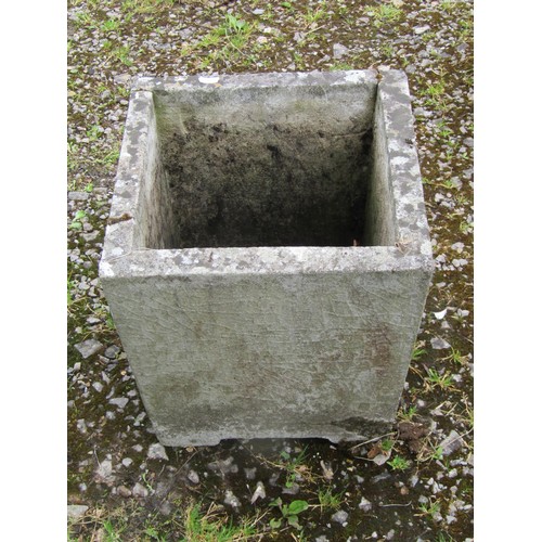 1057 - A weathered cast composition stone square tapered planter with raised relief detail, 34 cm square to... 