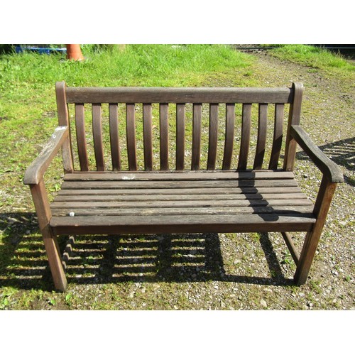 1061 - An Alexander Rose heavy gauge weathered teak two seat garden bench with curved slatted seat and back... 