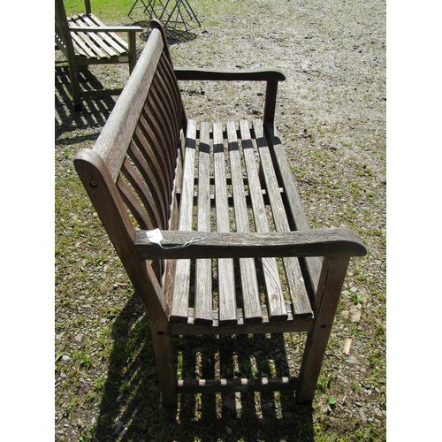 1061 - An Alexander Rose heavy gauge weathered teak two seat garden bench with curved slatted seat and back... 