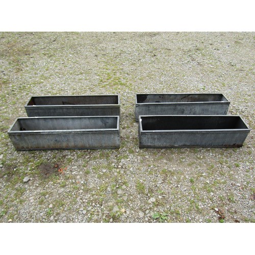 1065 - Four tin simulated lead narrow rectangular flower troughs with reeded detail, 20 cm high x 90 cm x 2... 