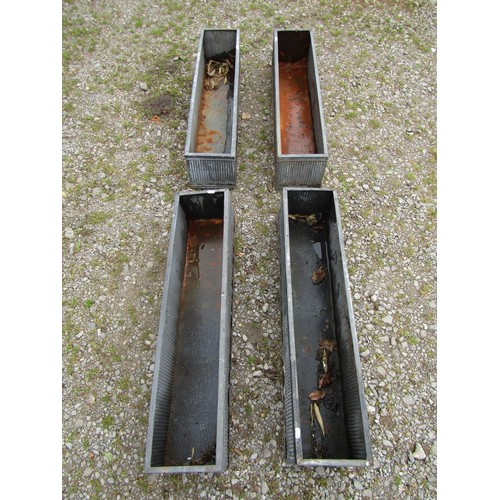 1065 - Four tin simulated lead narrow rectangular flower troughs with reeded detail, 20 cm high x 90 cm x 2... 