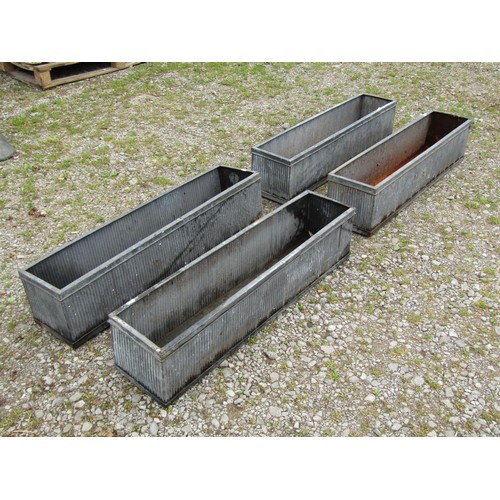 1065 - Four tin simulated lead narrow rectangular flower troughs with reeded detail, 20 cm high x 90 cm x 2... 