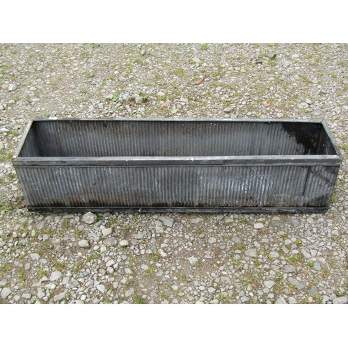 1065 - Four tin simulated lead narrow rectangular flower troughs with reeded detail, 20 cm high x 90 cm x 2... 