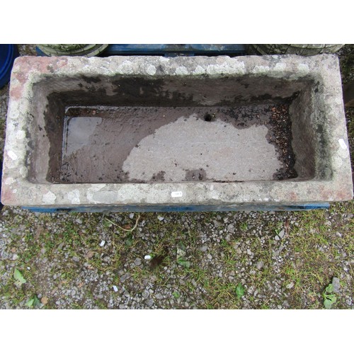 1069 - A weathered carved rectangular natural stone trough with small drilled circular drainage hole, 23 cm... 