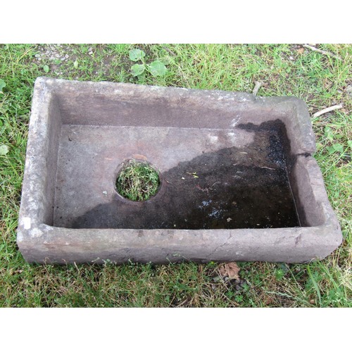 1072 - A weathered shallow rectangular stone trough/sink with circular drainage hole, 18 cm high x 71 x 44 ... 