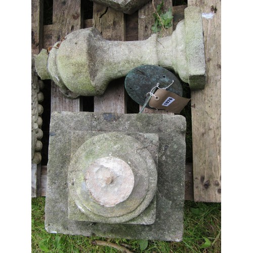 1076 - A garden sundial of circular form with pierced gnomon set on a weathered cast composition stone balu... 