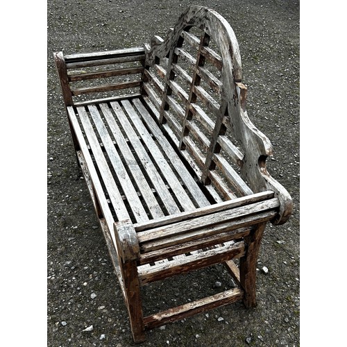 1027 - A weathered stained Lutyens style three seat garden bench 166 cm long