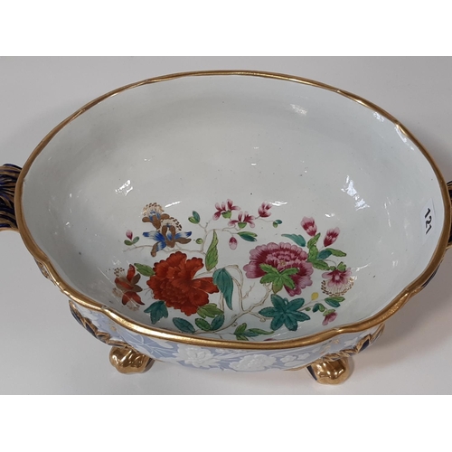 121 - A substantial 19th century porcelain open tureen of oval form with embossed and painted floral detai... 