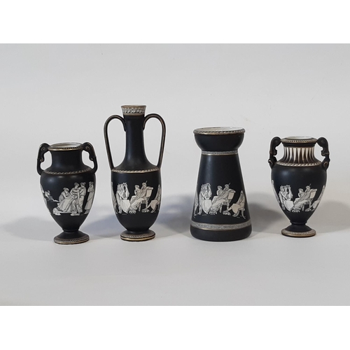 31 - A group of antique Pratt ware items, all with black ground to include twin handled vases, jugs, cand... 